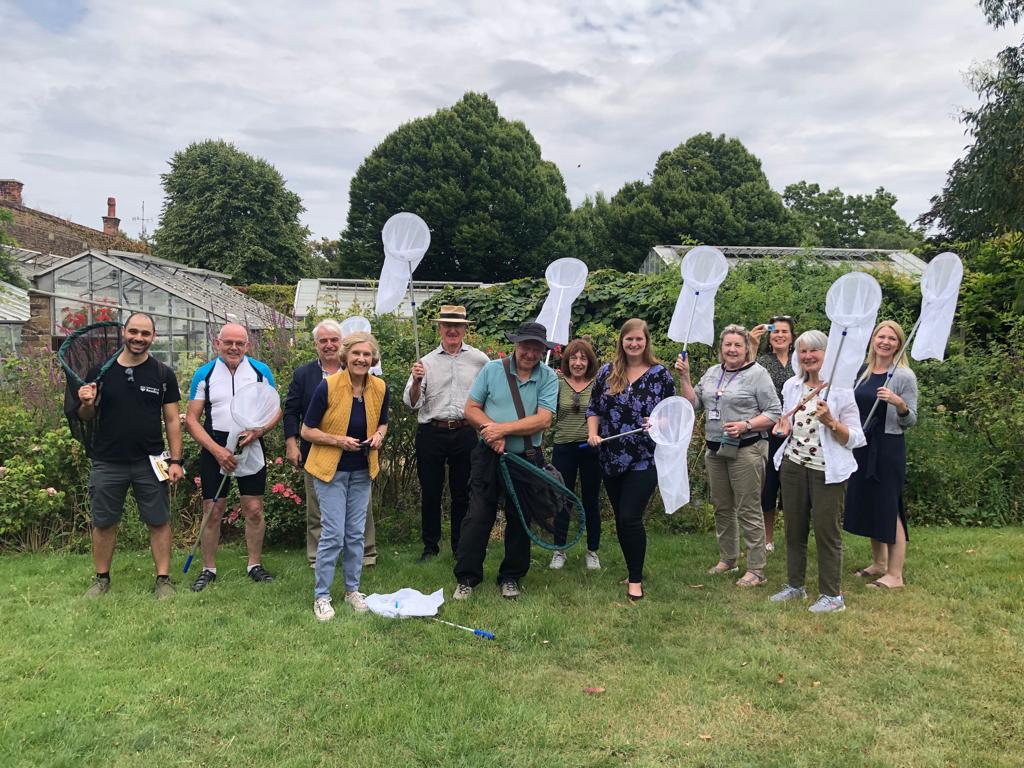 PLT Volunteers at work, posing for a photograph with their insect nets.