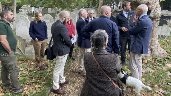 People on guided tour around Bunhill Fields